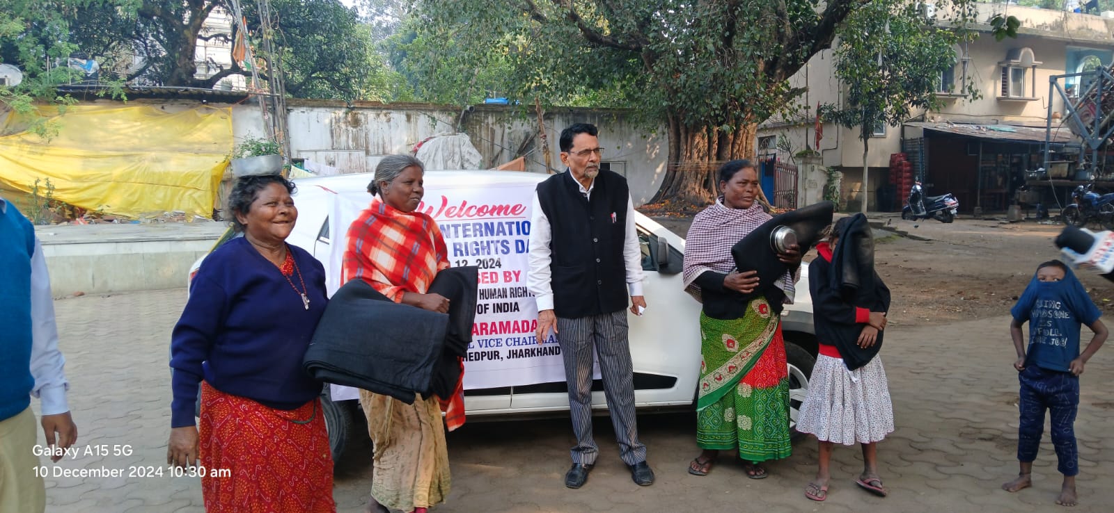 Dr. Jayaram Das distributing blankets at International Human Rights Day